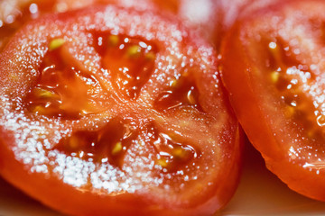 Close up slices of fresh juicy tomato
