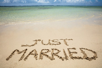 Just Married Text On Sand At Beach
