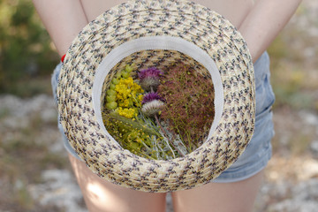 summer bouquet of flowers in a hat