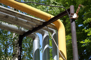 Outdoor industrial pipes of manufacturing plant on a sunny day