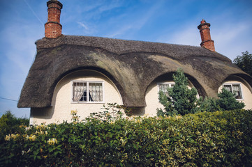 House with thatched roof near Ickwell hamlet in civil parish of Northill in UK