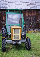 Old tractor on a farm in small village in Masovia region of Poland