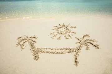 Sun, Palm Tree And Hammock Drawn On Sand At Beach