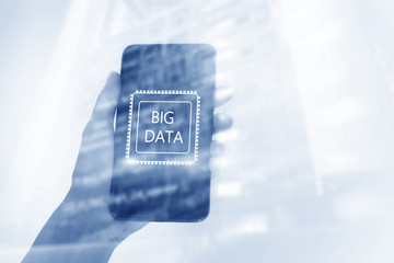 Woman Hand holding mobile phone. Server room background. Inscription on a virtual screen: Big Data. Double exposure.