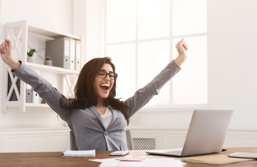 Yes! Happy Businesswoman Triumphing With Raised Hands