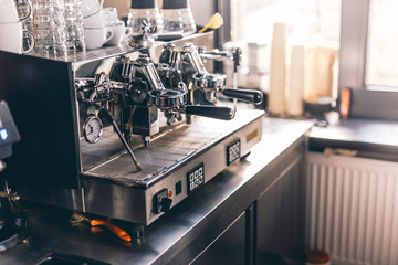 Group espresso machine with clean dishes on it