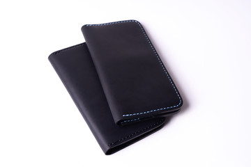 Two handmade leather black purse isolated on white background. Stock photo of luxury accessories.