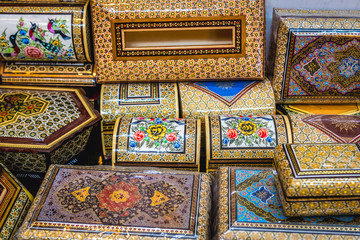 Close up on a decorated wooden and ivory boxes in souvenir shop in Shiraz, Iran