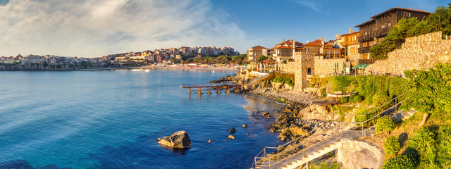 Coastal landscape banner, panorama - embankment with fortress wall in the city of Sozopol on the Black Sea coast in Bulgaria - obrazy, fototapety, plakaty