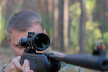 Shooting with an airgun in the forest