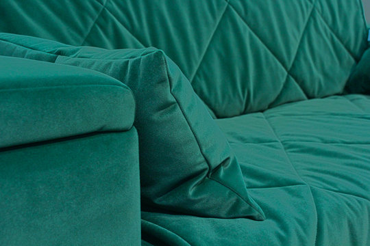 A Fragment Of A Green Velvet Sofa.