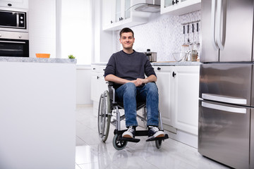 Happy Handicapped Man In Kitchen