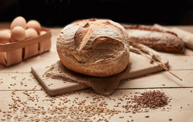 Fresh homemade bread on wooden background. Crisp. French bread. Bread at leaven. Unleavened bread.