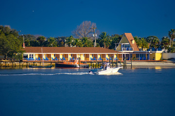 St. Augustine, Florida. January 26 , 2019. Sailboat and colorful motel on blue sky background in...