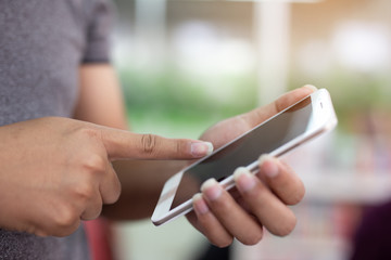 Young man is using the phone.