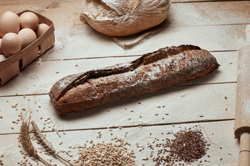 Freshly baked bread .Top view of sliced wholegrain bread on dark ructic wooden  background closeup. Bread at leaven. Unleavened bread.