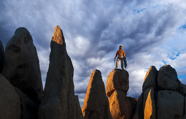 Rock climber celebrates on the summit.