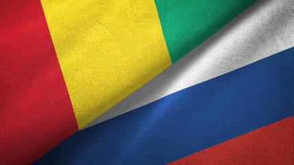 Guinea and Russia two flags textile cloth, fabric texture