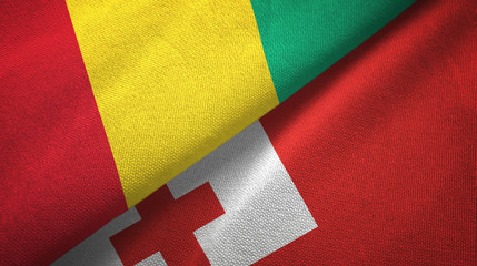 Guinea and Tonga two flags textile cloth, fabric texture