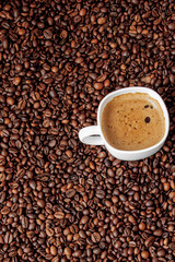 Coffee cup on wooden table. View from top