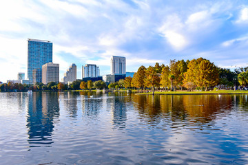 Orlando, Florida . December 24, 2018. Lake Eola Park and colorful business buildings on beautiful...