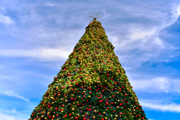 Orlando, Florida . December 24, 2018. Top view of Christmas Tree on bluelight sky background in...