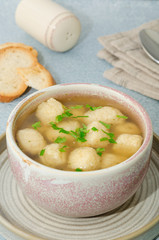 Homemade matzo ball soup. Dumpling chicken soup