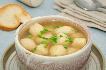 Homemade matzo ball soup. Dumpling chicken soup