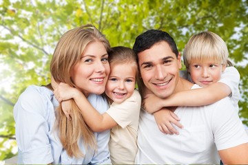 Fototapeta premium Happy smiling family with daughter over green