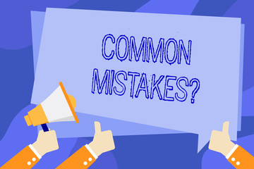 Writing note showing Common Mistakes Question. Business concept for repeat act or judgement misguided making something wrong Hand Holding Megaphone and Gesturing Thumbs Up Text Balloon