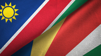 Fototapeta premium Namibia and Seychelles two flags textile cloth, fabric texture