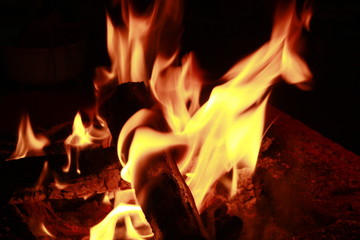 Beautiful stylish artistic fire flames on black background.
