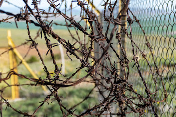 Fototapeta na wymiar creating barbed fence to prevent smuggling and immigrants at the borders,
