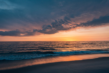 Fototapeta na wymiar Colorful sunset over the Pacific Ocean, at Windansea Beach, in La Jolla, San Diego, California