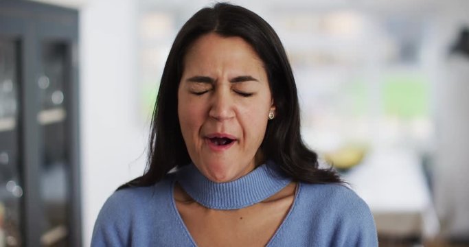 4K Close up beautiful Hispanic woman yawning, smiling & pulling expressive faces