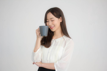 Fototapeta premium portrait of thai china adult office girl white shirt drinking coffee