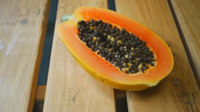 Close up of sliced papaya fruit. Half of yellow papaya.