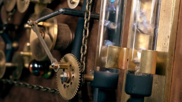 Steampunk, the mechanism of a time machine with rotating gears, flasks in which bubbles in a liquid, a chain,Very similar to a clock mechanism or a working device in the old style.