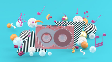 Music Tape among the colorful balls on the blue background.-3d rendering.