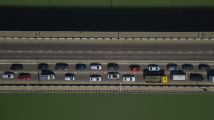 Drone's Eye View - Aerial top down view of urban traffic jam on bridge