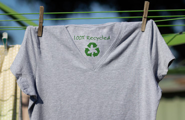 Recycle clothes icon on t shirt with 100% Recycled text, sustainable fashion concept illustration...