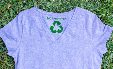 Recycle clothes icon on t shirt with 100% Recycled text, sustainable fashion concept illustration...