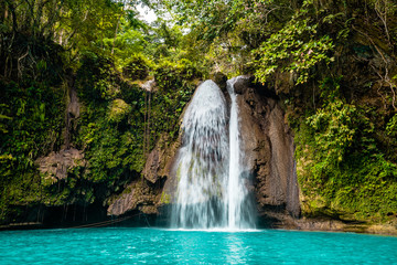 Kawasan Falls on Cebu island in Philippines, turquoise waterfalls