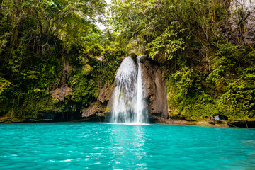 Fototapeta na wymiar Kawasan Falls on Cebu island in Philippines, turquoise waterfalls