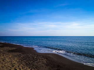 Black Sand And Beach Horizon View In The Morning At Umeanyar Village, North Bali, Indonesia
