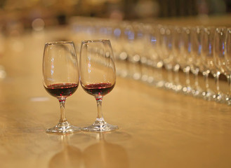 A glass of red wine is on the table