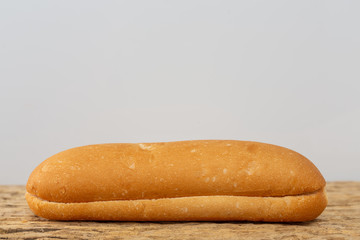 Bread on a wooden table on an old wooden floor.