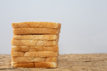 Bread on a wooden table on an old wooden floor.