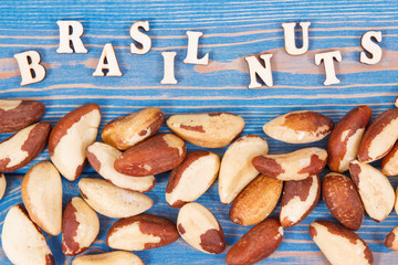 Inscription brasil nuts and fruits containing natural minerals and vitamin on old boards