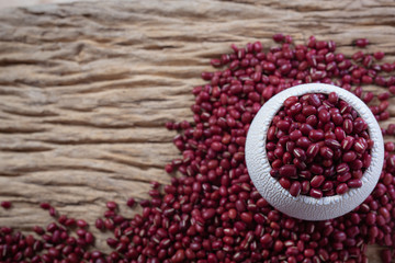 Red bean seeds on a wooden background in the kitchen